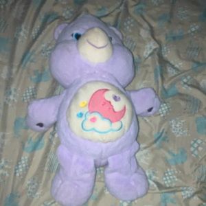 About 1 ft in a half light purple and care bear